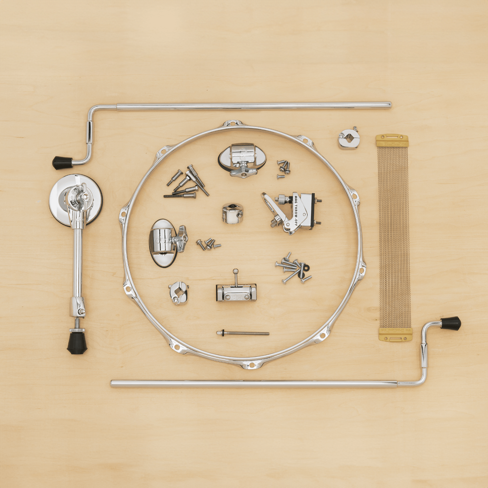A collection of DW spare parts including tom legs, lugs, tension rods, snares, and more.