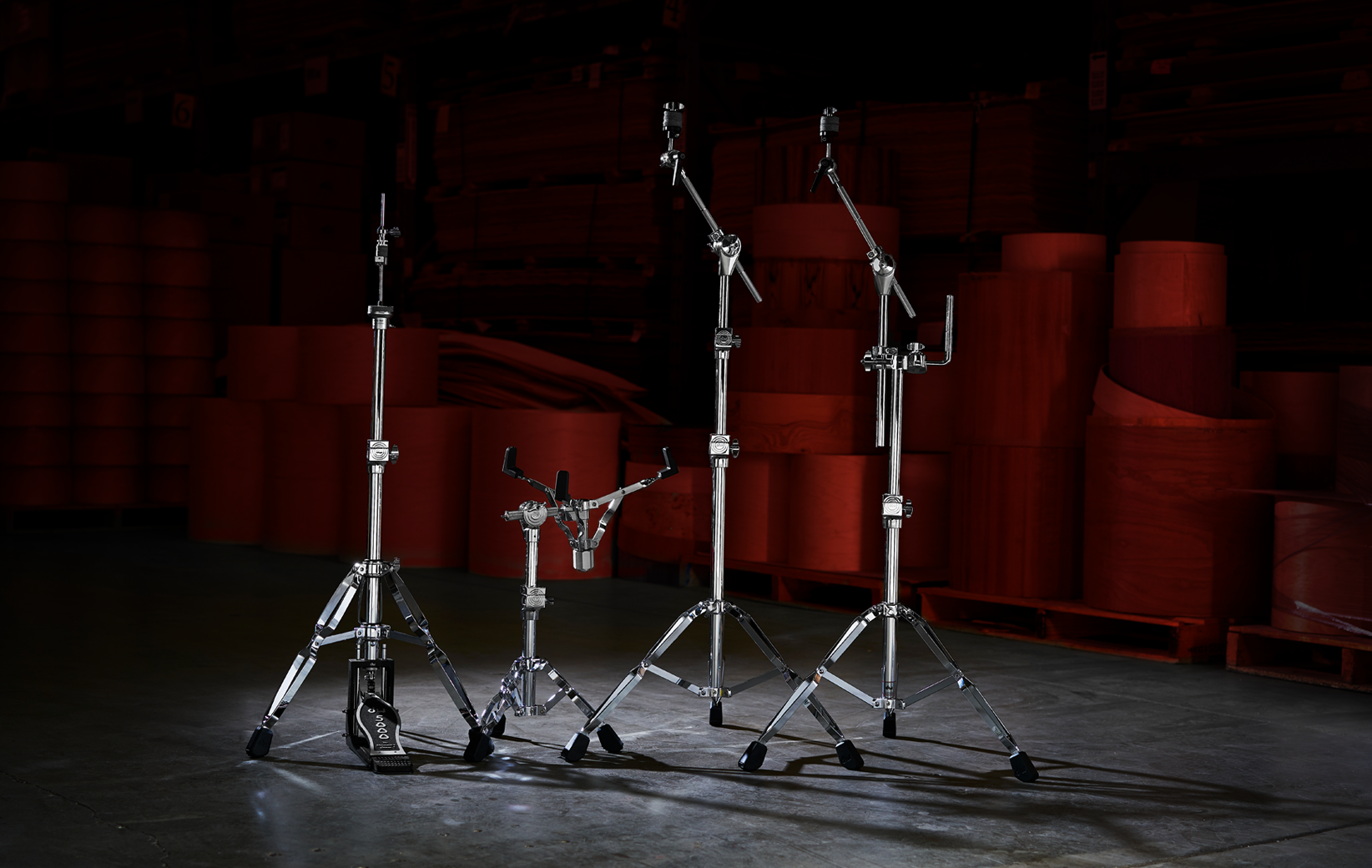 A full line of the classic DW 5000 Series hardware series including a double-braced hi-hat stand, snare stand, boom stand, and boom stand with accessory arm.